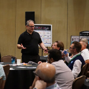 Industry leader presenting to professionals during garment care workshop