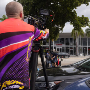 Film crew recording content outside a Sudsies boutique location