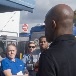Team members listening during garment care operations discussion